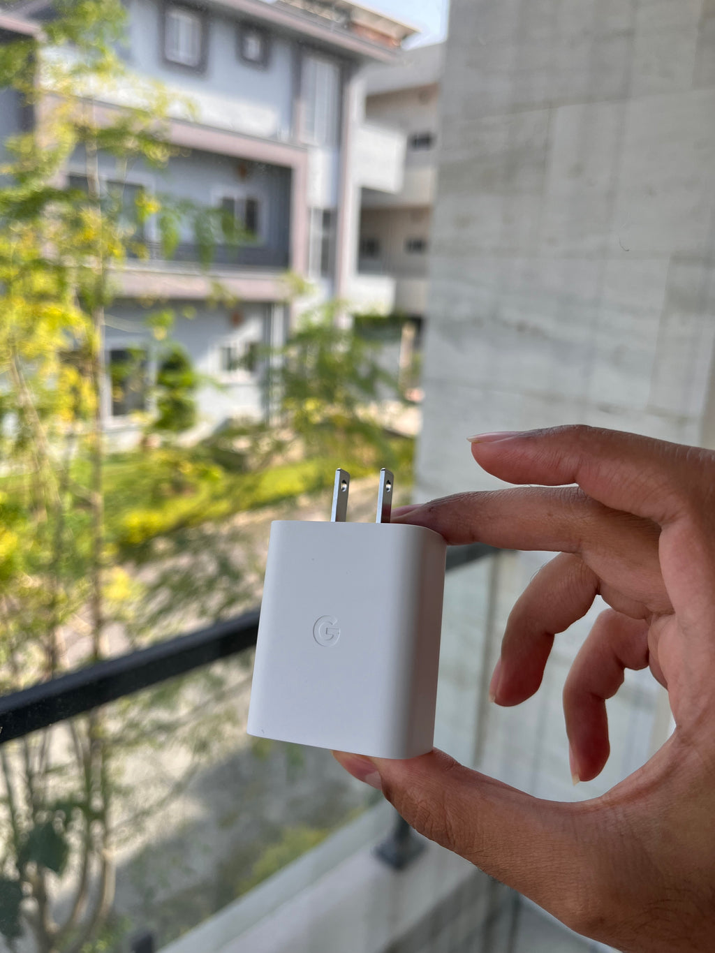 White Google Pixel 30W charger body with Google logo and flat plug pins